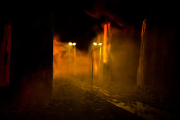 Empty street of burnt up city, flames on the ground and blasts with smoke in the distance....