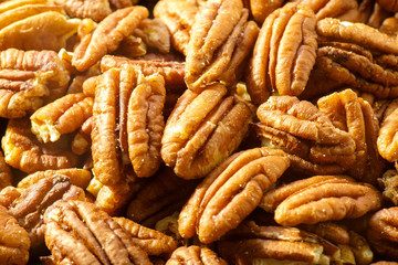 Pecans nuts. A close-up photograph. Unrefined whole kernel 