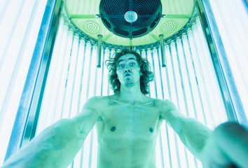 Young Thin Man At Solarium In Beauty Salon