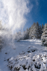 Obraz na płótnie Canvas Snow covered winter wonderland landscape in the mountain