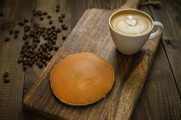 pancake with coffee on wooden table
