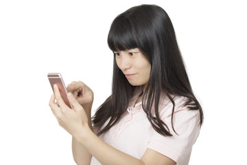 Asian woman using a smart phone to send a text message isolated on white background