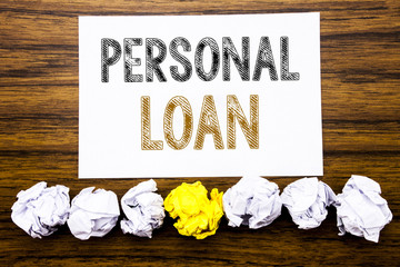 Word, writing Personal Loan. Concept for Bank Financial Help Written on sticky note paper reminder, wooden background with sticky, one folded paper alone for difference or collaboration