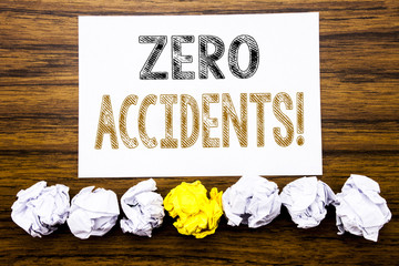 Word, writing Zero Accidents. Concept for Safety At Work Hazard Written on sticky note paper reminder, wooden background with sticky, one folded paper alone for difference or collaboration