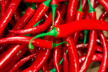 Red peppers background texture of hot red chili, seasoning paprika, fiery red hot in the kitchen a dish of red pepper for sale