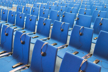 headphones and  receivers on the chairs