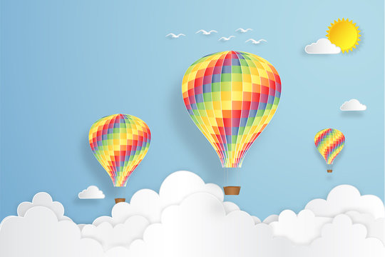 Colorful hot air balloon flying under blue sky and sunny as paper art, craft style concept. vector illustration.