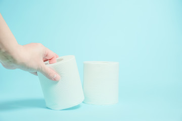 Stock of the toilet paper. トイレットペーパーの補充　水色背景