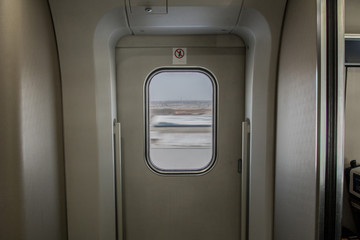 The view from inside the train's doors in the winter