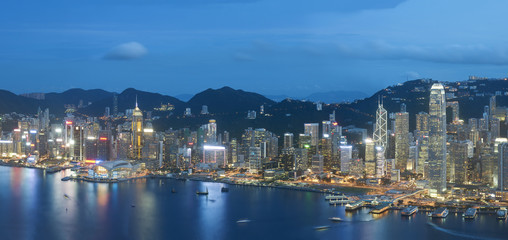 Fototapeta na wymiar Panorama view of Victoria Harbor of Hong Kong city at dusk