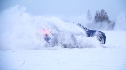 Sliding on an ice line. Snow drifting. snowy land road at winter