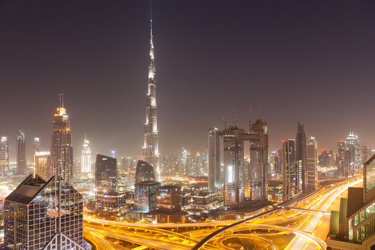 DUBAI, UAE - FEBRUARY 2018: Dubai skyline at sunset with Burj Khalifa, the world tallest building and Sheikh Zayed road traffic