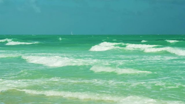 Super high definition video of waves coming ashore on a windy day in popular Miami Beach.