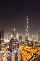 Fototapeta premium DUBAI, UAE - FEBRUARY 2018: Dubai skyline at sunset with Burj Khalifa, the world tallest building and Sheikh Zayed road traffic