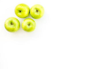 Fresh green apples on white background top view copy space