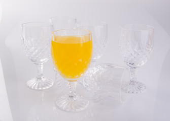 Orange juice in glasses on white background.