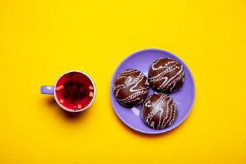 cup of red tea with chocolate cookies