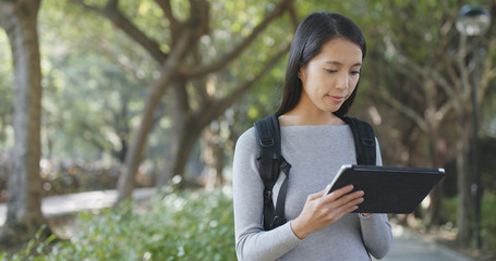 Fototapeta premium Woman use of tablet computer at outdoor