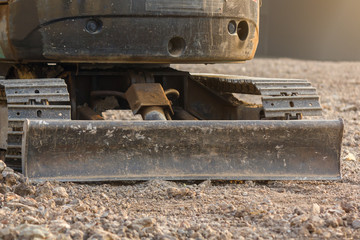 Bulldozer (Continuous Tracked Tractor) parking on soil at construction site