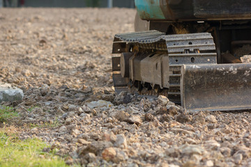 Bulldozer (Continuous Tracked Tractor) parking on soil at construction site