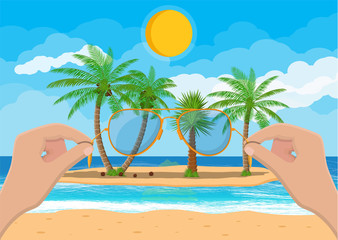 Landscape of beach, hand with sunglasses.