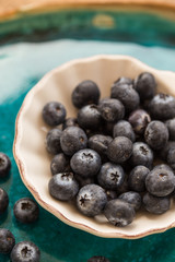 Healthy eating. Blueberries in small  white ceramice plate