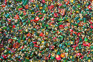 Colorful peppers on the sauce.