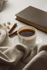 Cup with Coffee, Scarf, Book on the White Background