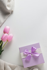 Scarf, Tulips, Gift Corby on the White Background. Spring Concept. Flat lay, top view