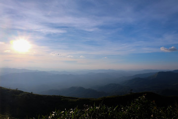 Obraz premium Beautiful mountain landscape, with mountain peaks covered with forest and a cloudy sky