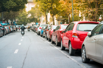 Cars parked on the urban street side