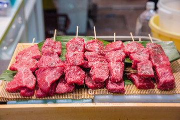 Raw beef ready for grilling at a shop in Kuromon ichiba market in Osaka,Japan.