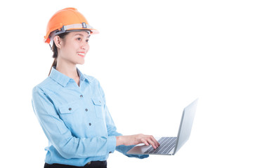 Beautiful engineer woman wearing helmet and using notebook computer over white background