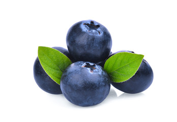 blueberries with green leaves isolated on white background