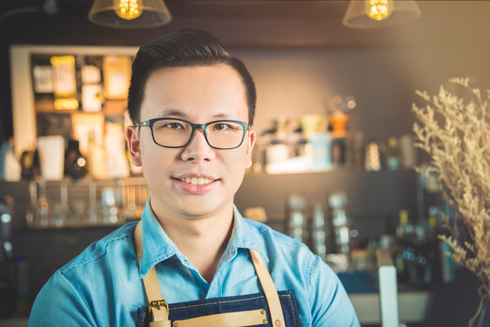 Handsome Asian Coffee Shop Owner Smiling In His Shop