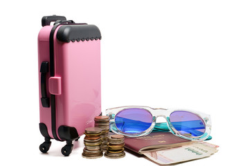 Pink luggage, Thai money stack of coin, banknotes, passport and fashion sunglasses