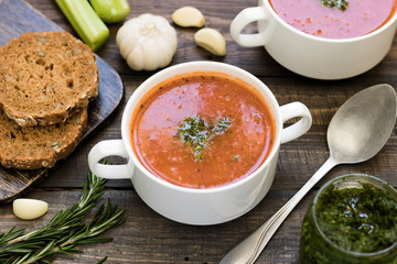 Thick Italian soup minestrone on a wooden table