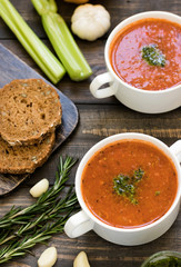 Thick Italian soup minestrone on a wooden table