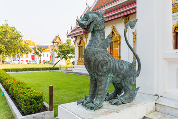 Singha or the lion statue in front of Thai temple represent the guardian who protect the temple...