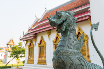 Singha or the lion statue in front of Thai temple represent the guardian who protect the temple from the evil