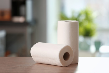 Rolls of paper towels on kitchen table