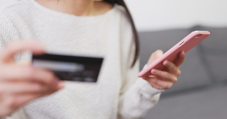 Online shopping at home with credit card and mobile phone