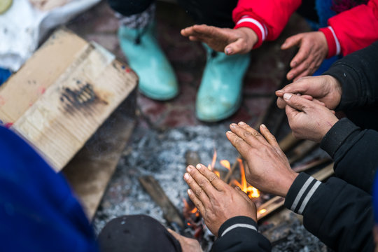 Hands Of Rural Minority People Warming Up Around The Fire During The Cold Weather Days In Mountaious Region In Vietnam