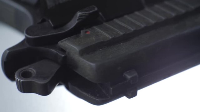 CSI expert table - gun close up, close up automatic pistol handgun weapon on white background