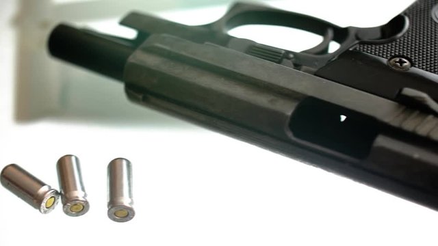 CSI expert table - gun close up, close up automatic pistol handgun weapon on white background