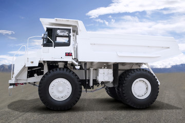 Big white mining truck parked on open cast mine
