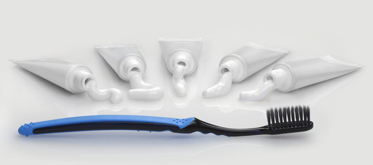Five white tube with white toothpaste and black toothbrush