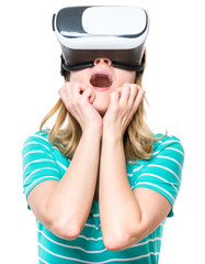 Amazed woman wearing virtual reality goggles watching movies or playing video games, isolated on white background. Surprised girl looking in VR glasses. People experiencing 3D gadget technology.