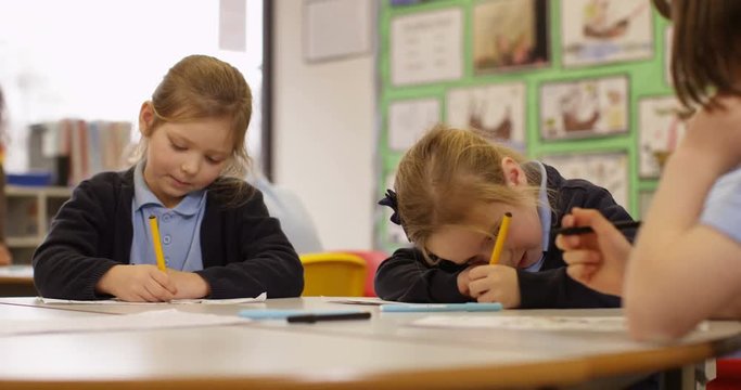 4k, Students taking an exam in a classroom. Slow motion.