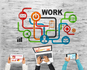 Top view of businesspeople sitting at table and using gadgets